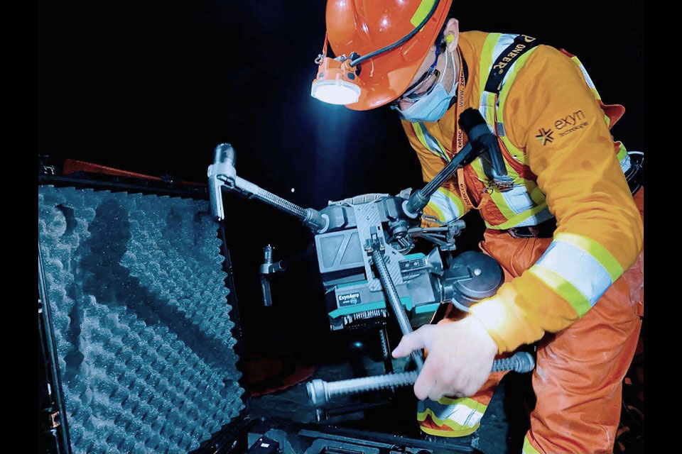 Image of an Aerial drone created by Exyn Technologies, equipped with gas sensors created by Maestro Digital Mine of Sudbury, being taken out of its case to be used in an underground mine.