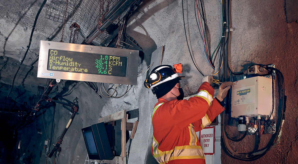 Image of a technician working underground on a Vigilante AQS installation system