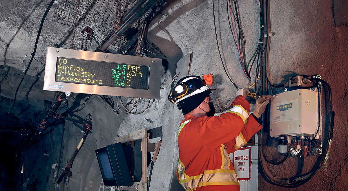 Image of a technician working underground on a Vigilante AQS installation system