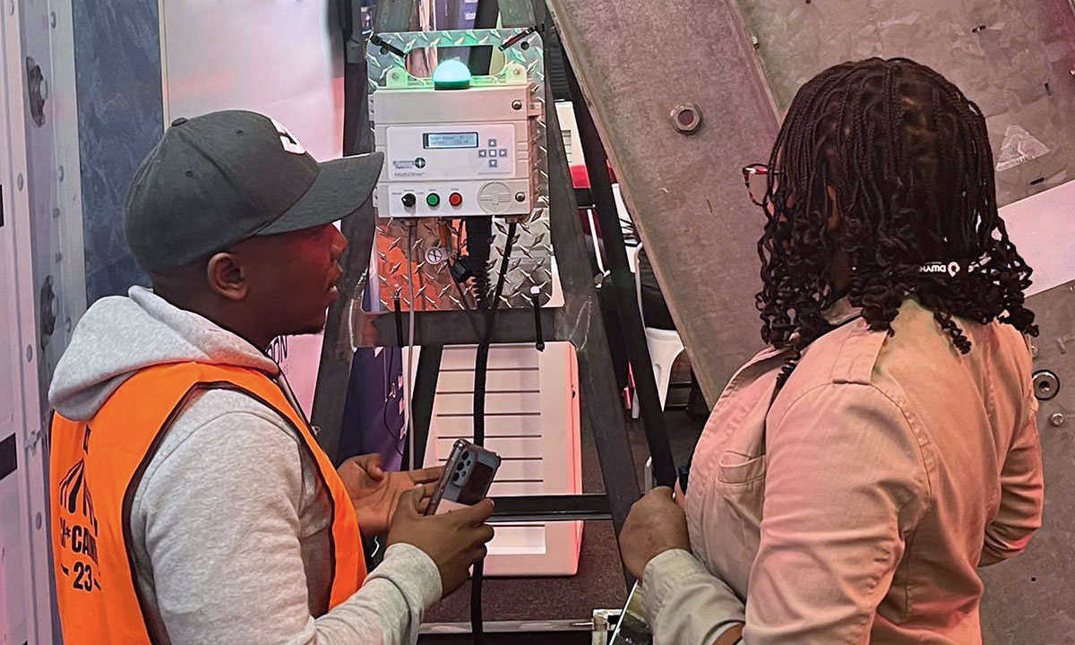 Image of two employees at Dwyka Tech Carnival operating the MaestroFlex Automated Regulators 