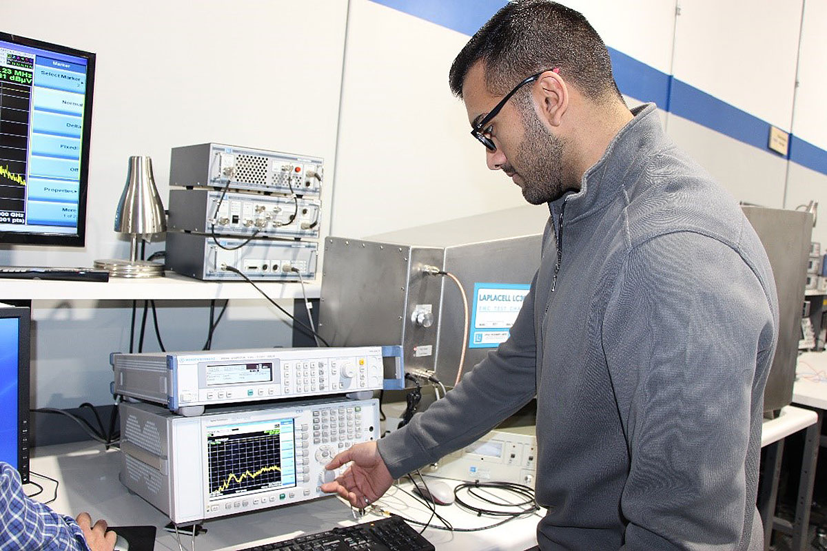 Jahanzeb Sohail, an electrical engineer with Maestro Digital Lab, carefully monitors EMC testing of a product in the final stages of development.